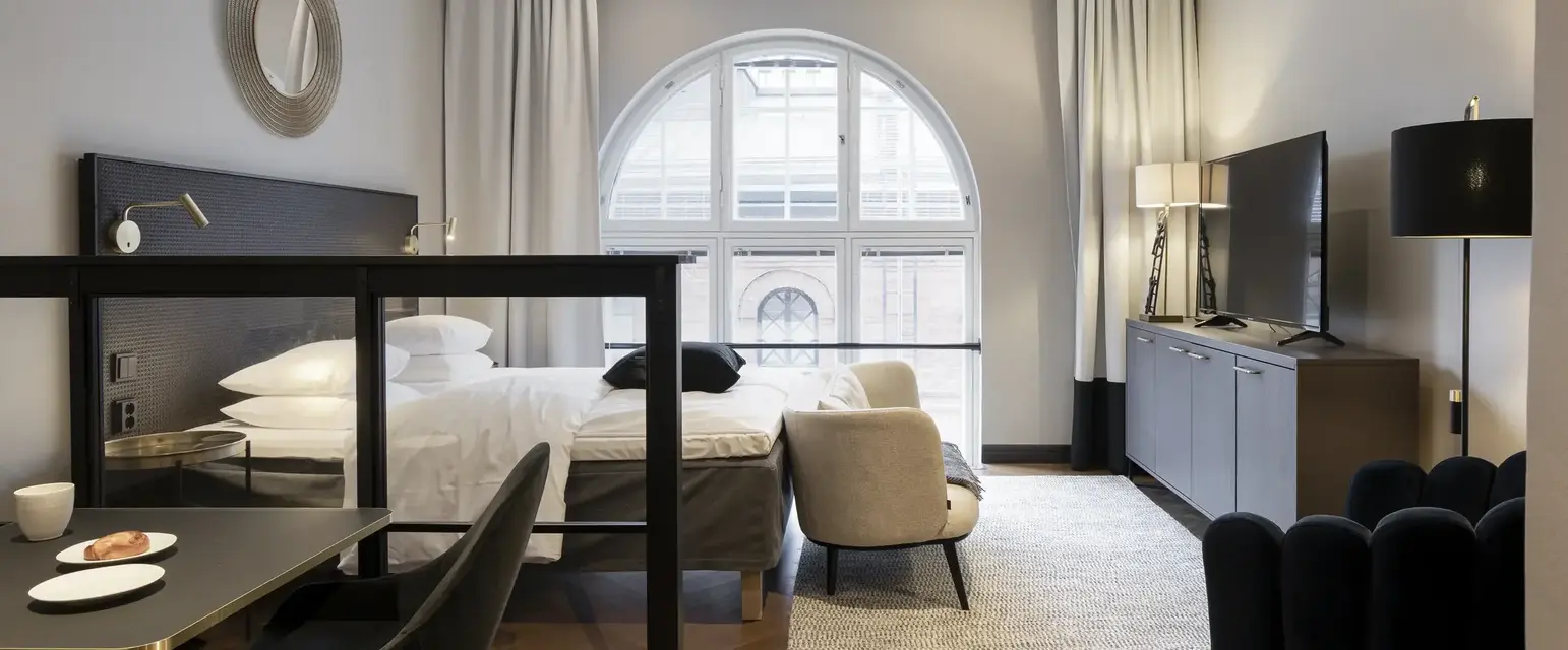 a room with a bed and a tv