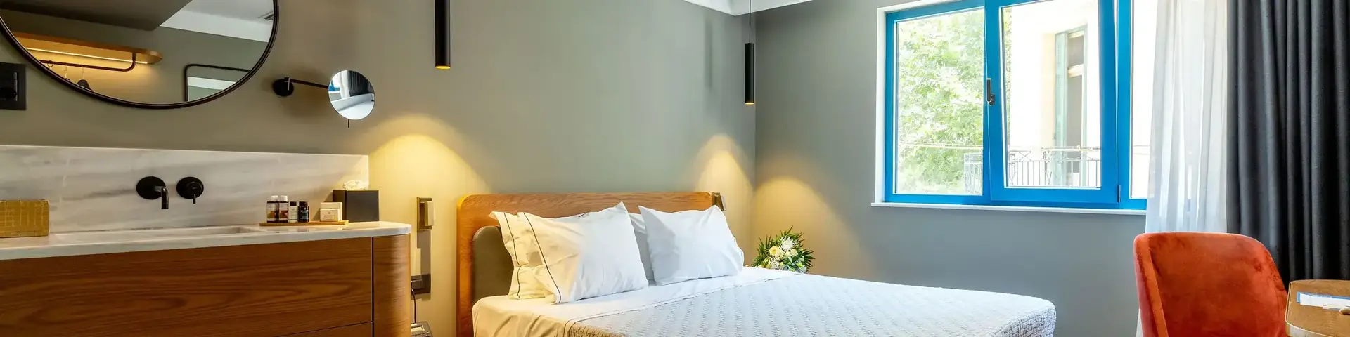 a bedroom with a mirror and a bed