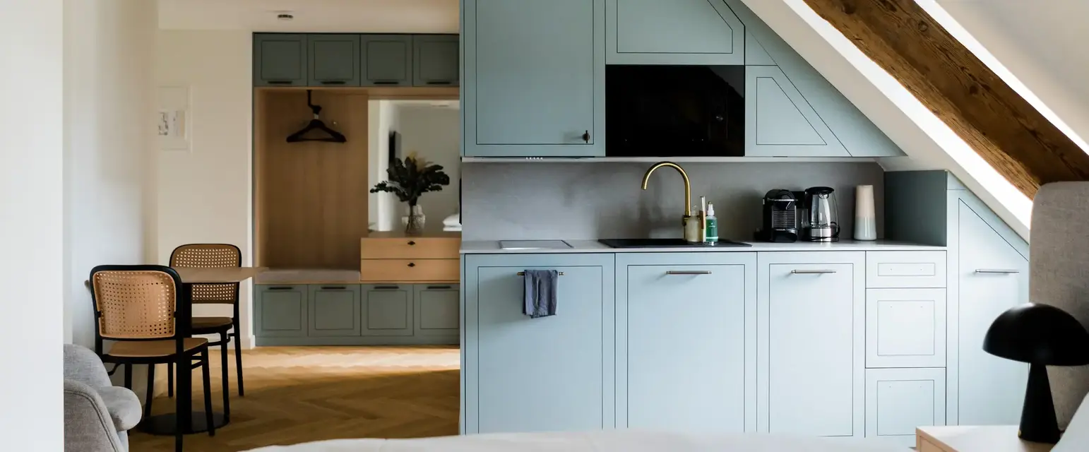 a kitchen with a bed and a table