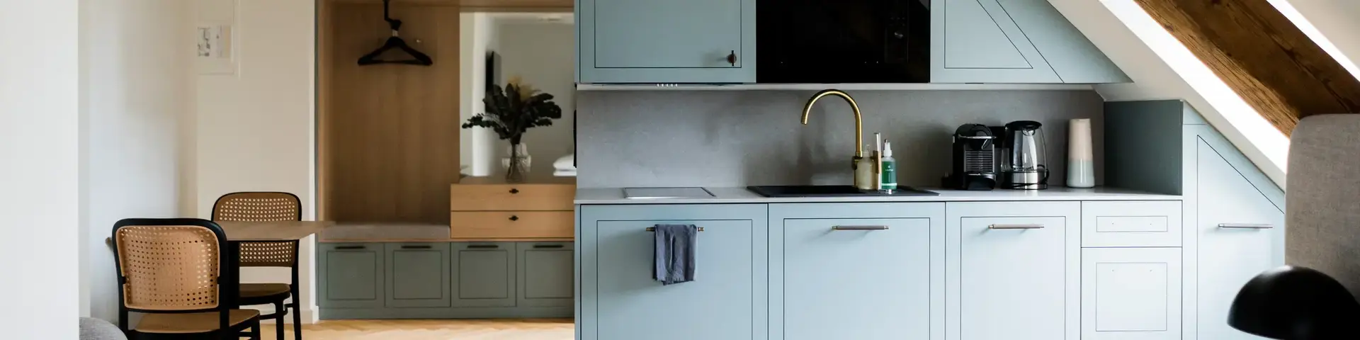 a kitchen with a bed and a table