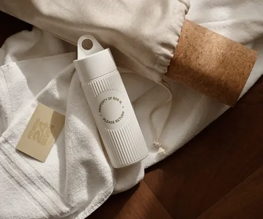 a white bottle and a white towel