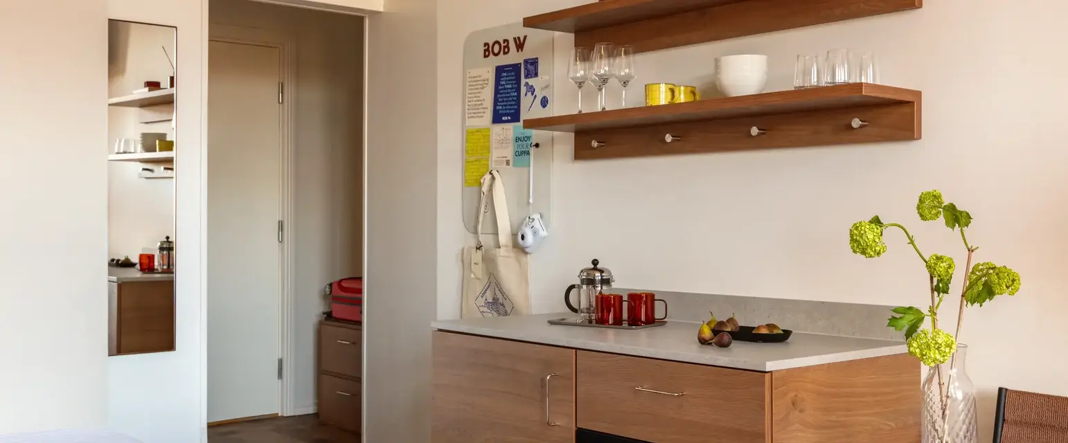a kitchen with a red and white blanket