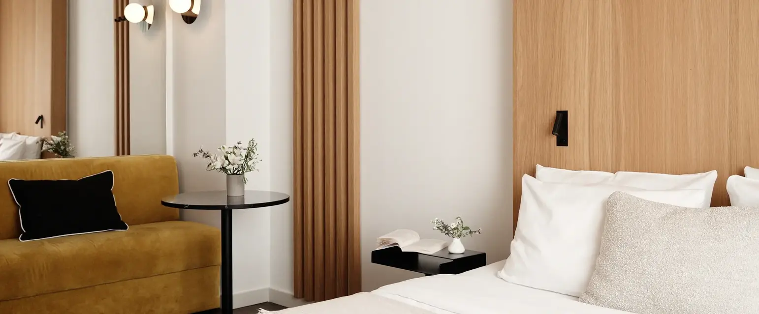 a bedroom with a bed and a couch