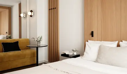 a bedroom with a bed and a couch