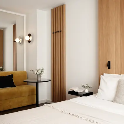 a bedroom with a bed and a couch