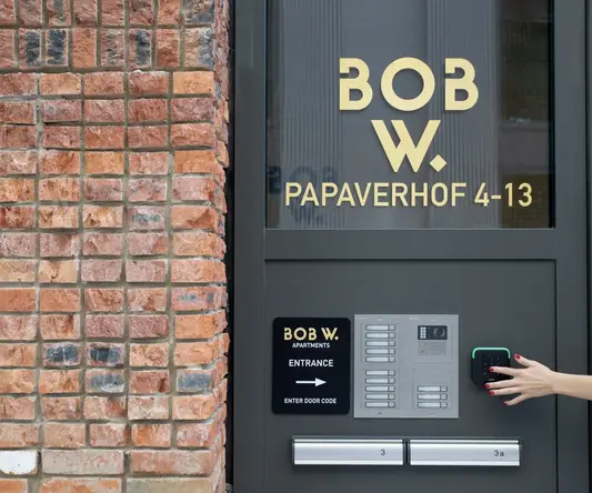 a person's hand on a door