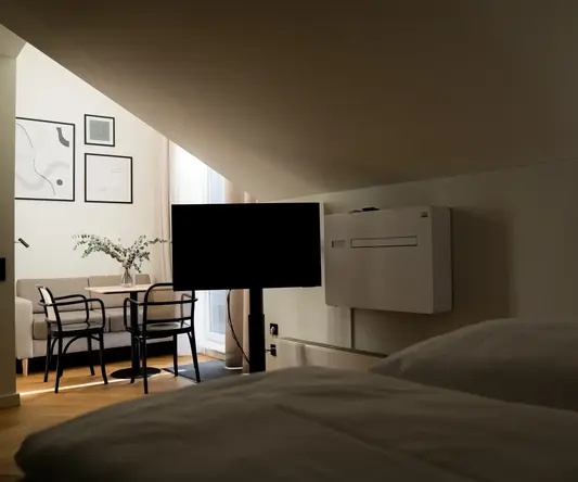 a room with a tv and a table