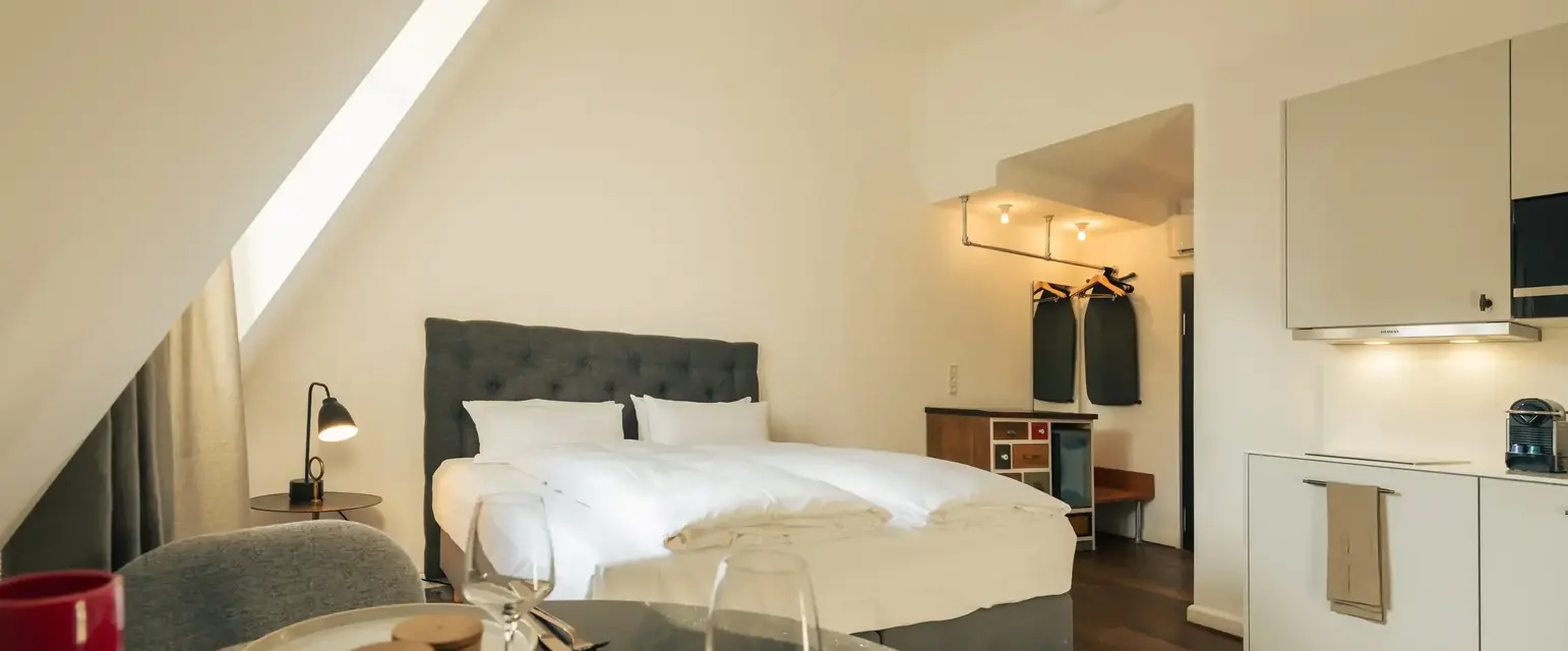 a bedroom with a bed and a table