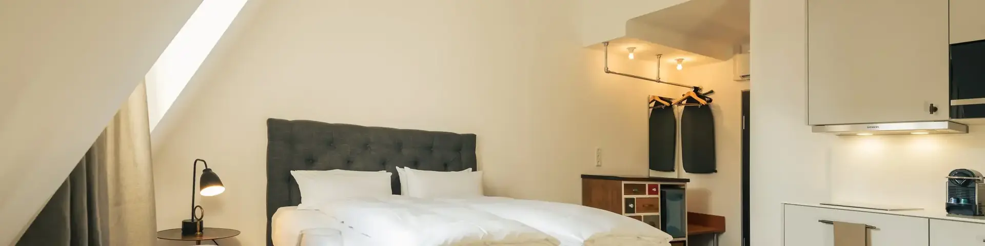 a bedroom with a bed and a table