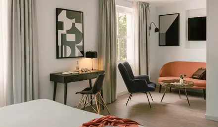 a room with a bed and chair