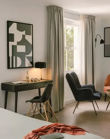 a room with a bed and chair