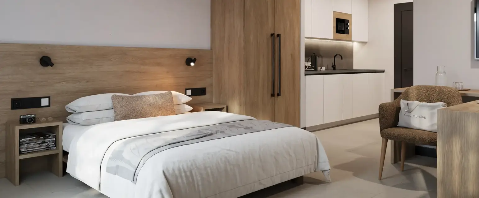 a bedroom with a bed and a microwave