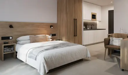 a bedroom with a bed and a microwave
