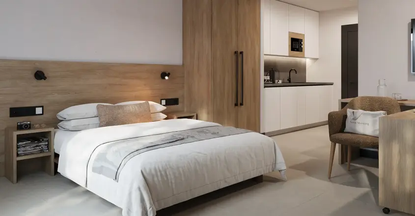 a bedroom with a bed and a microwave