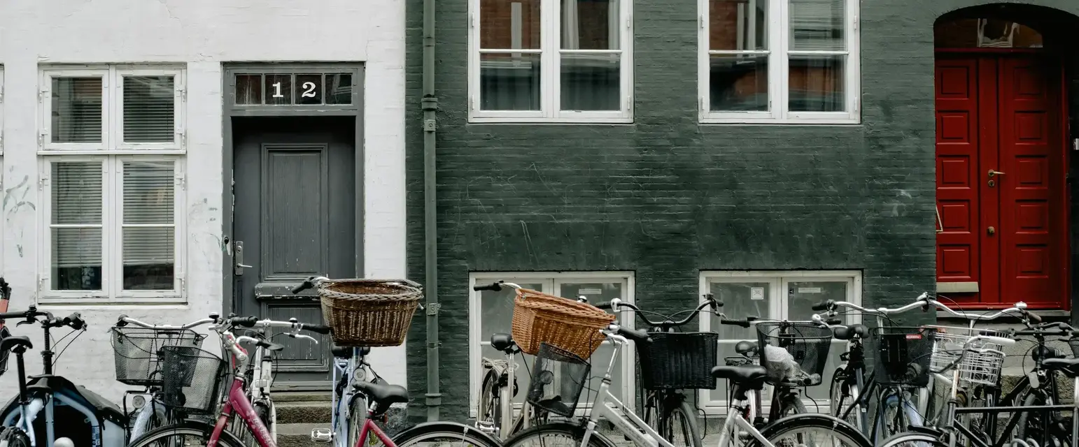 a group of bicycles parked in front of a building