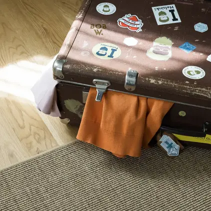 a suitcase with stickers on it