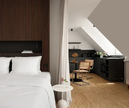 a bedroom with a desk and a chair