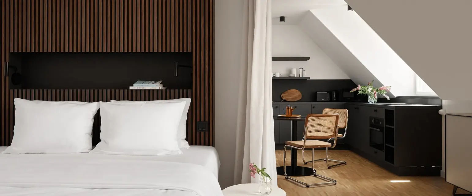 a bedroom with a desk and a chair