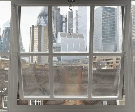 a window with a city view through it