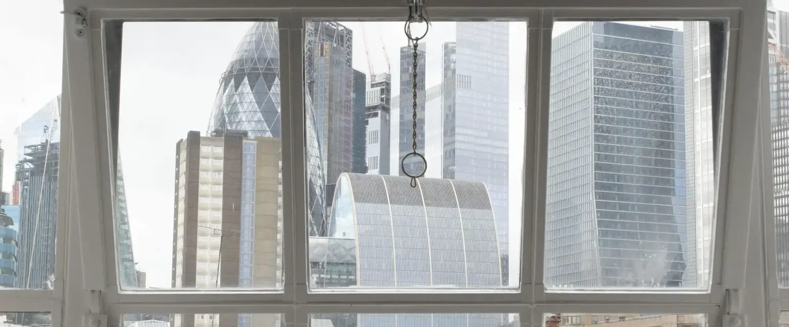 a window with a city view through it