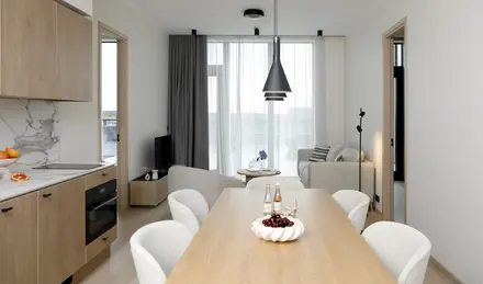 a room with a table and chairs