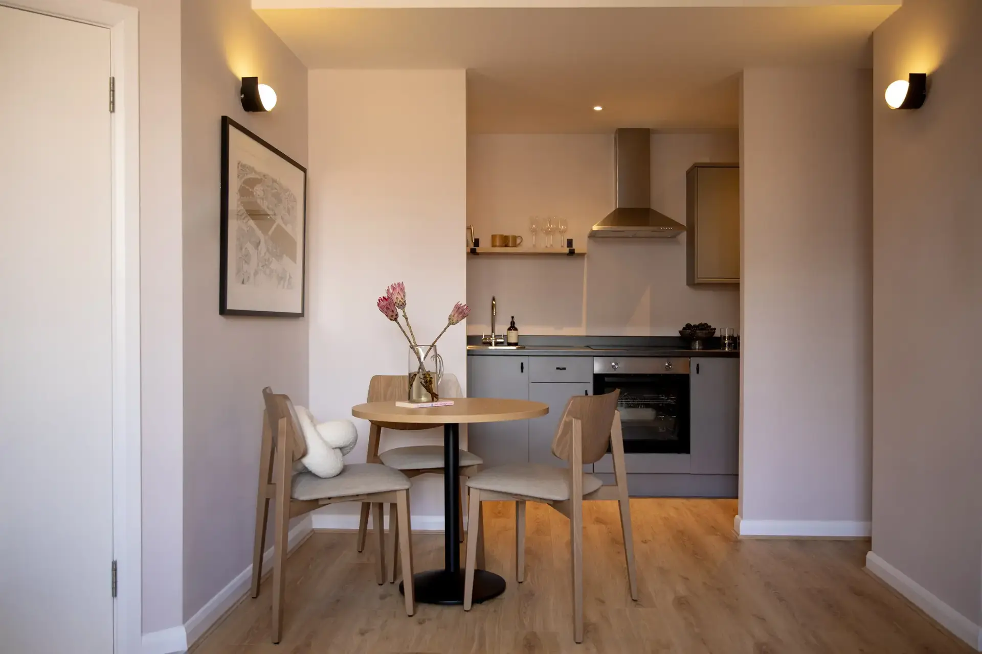 a kitchen with a table and chairs
