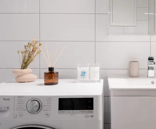 a washer and sink in a bathroom