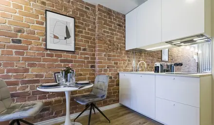 a kitchen with a table and chairs