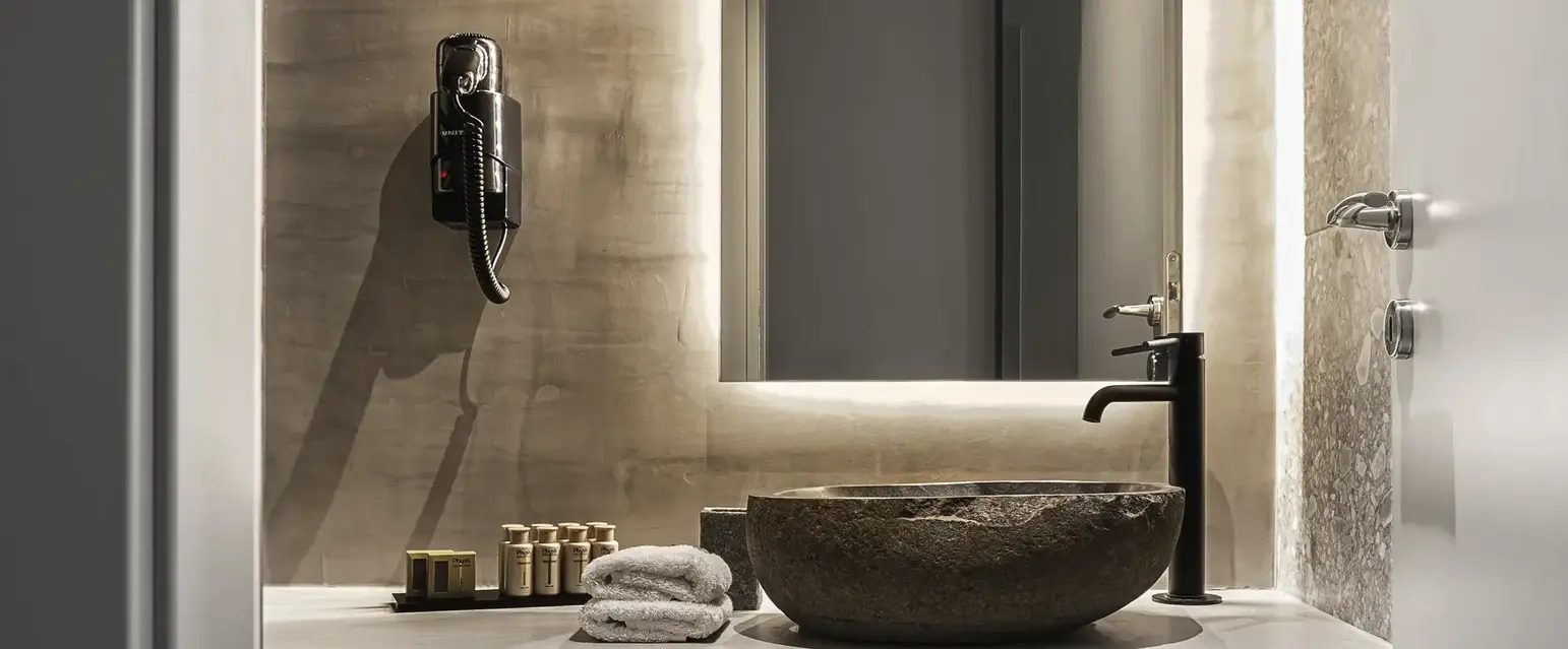 a bathroom with a sink and towels
