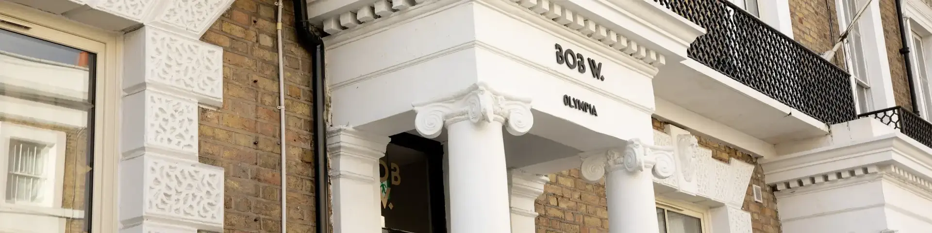 a building with columns and a balcony