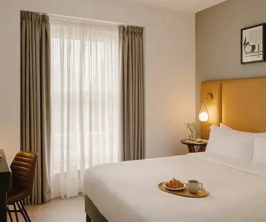 a bed with a tray of food on it