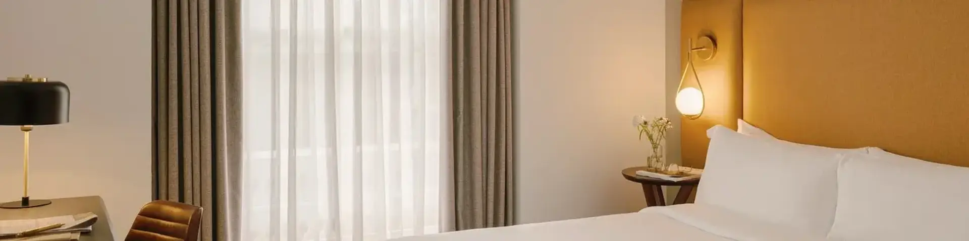 a bed with a tray of food on it