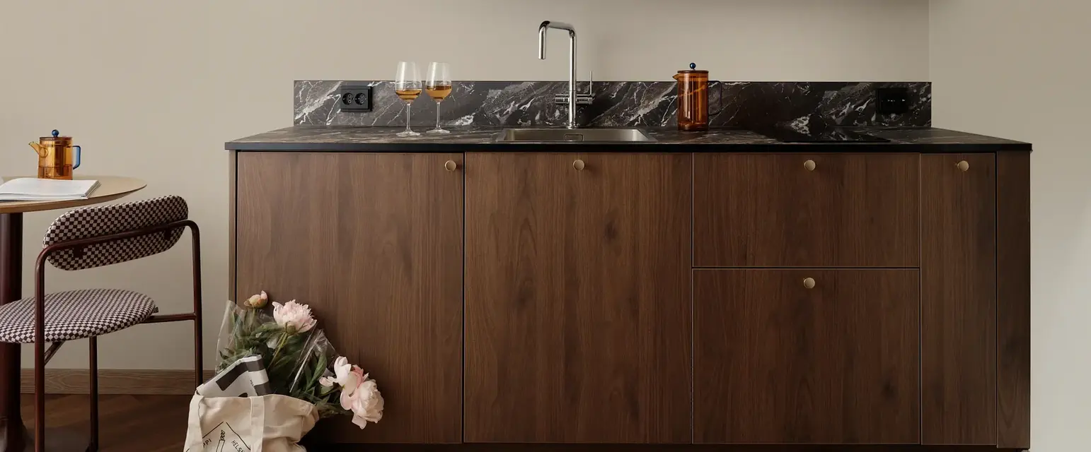 a kitchen with a sink and a bag of flowers