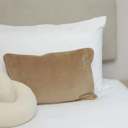Design highlight of cushions on bed and bedside table