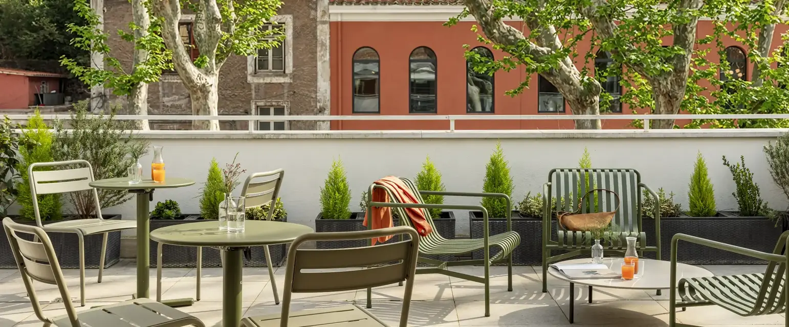a patio with tables and chairs
