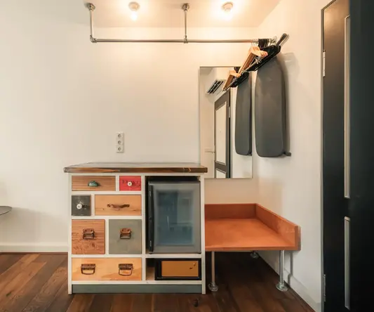 a room with a counter and a mirror