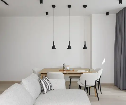 a dining table and chairs in a room