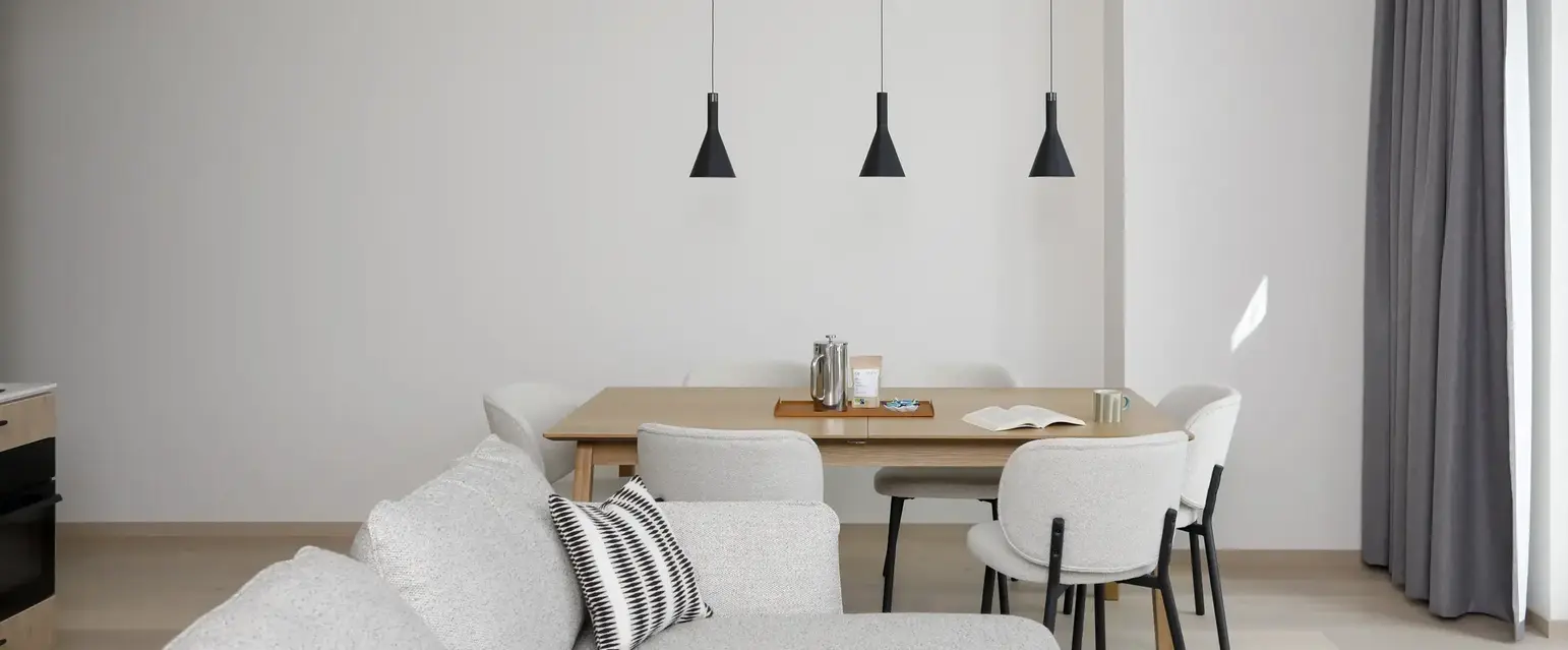 a dining table and chairs in a room