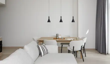 a dining table and chairs in a room