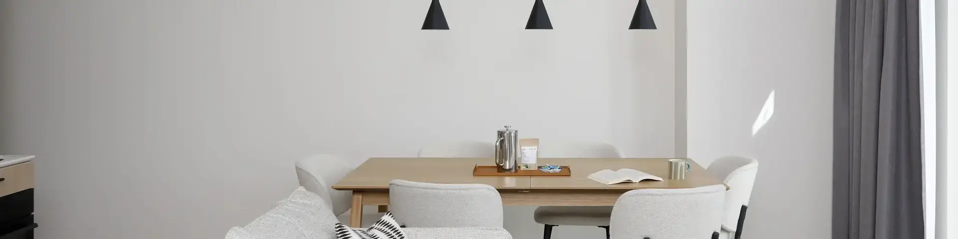 a dining table and chairs in a room