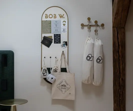 a board with a board and bags on the wall
