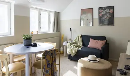 a living room with a couch and a round table