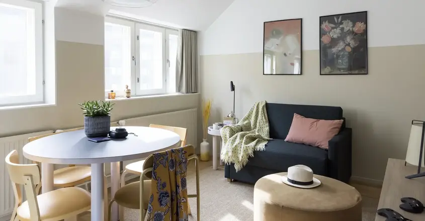 a living room with a couch and a round table