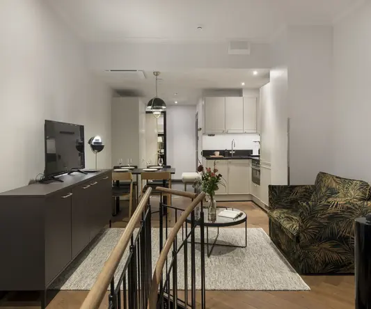 a living room with a tv and a table