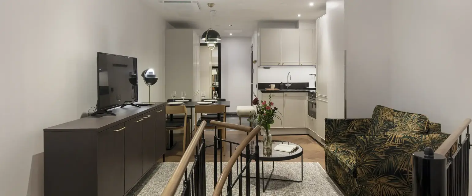 a living room with a tv and a table