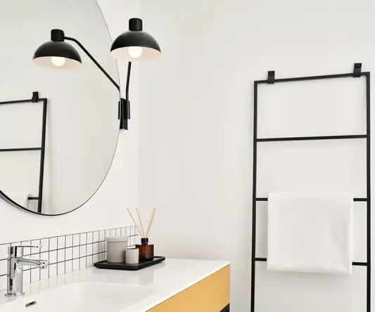 a bathroom with a mirror and sink