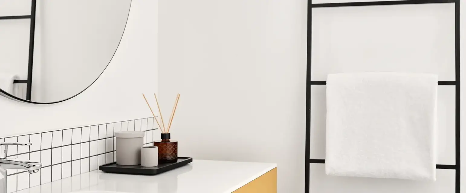 a bathroom with a mirror and sink