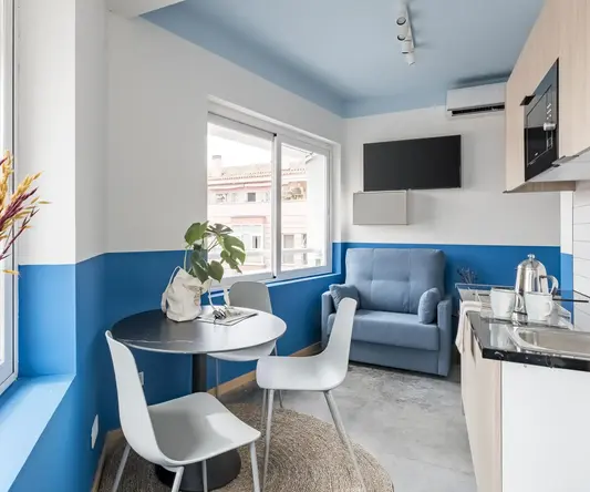 a room with a table and chairs