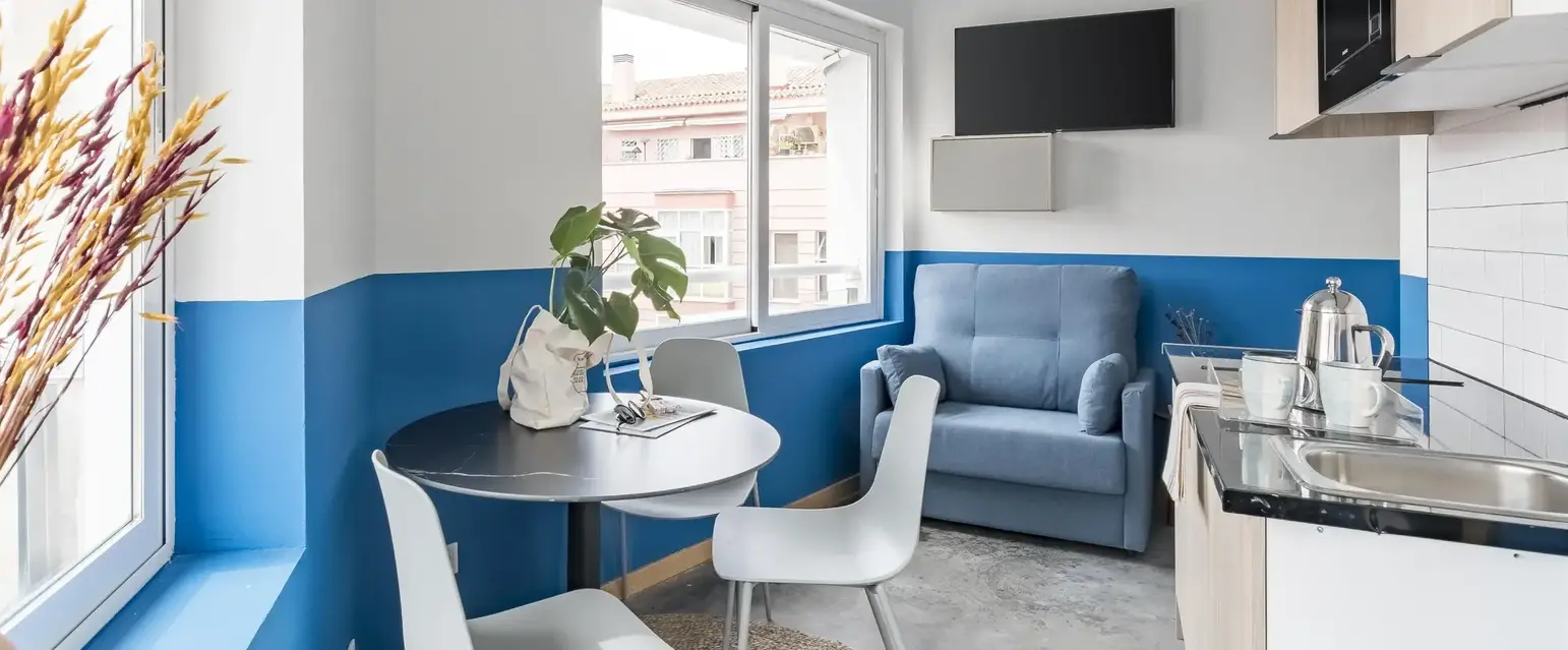 a room with a table and chairs