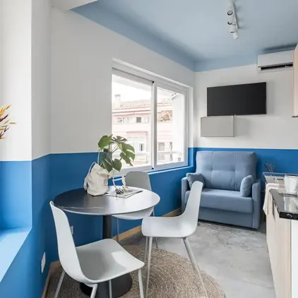 a room with a table and chairs